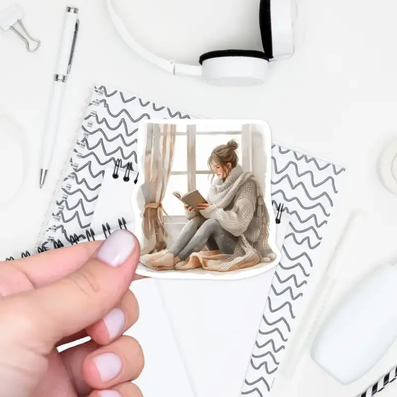 Samolepka do diáře - chvilka s knihou u podzimního okna.