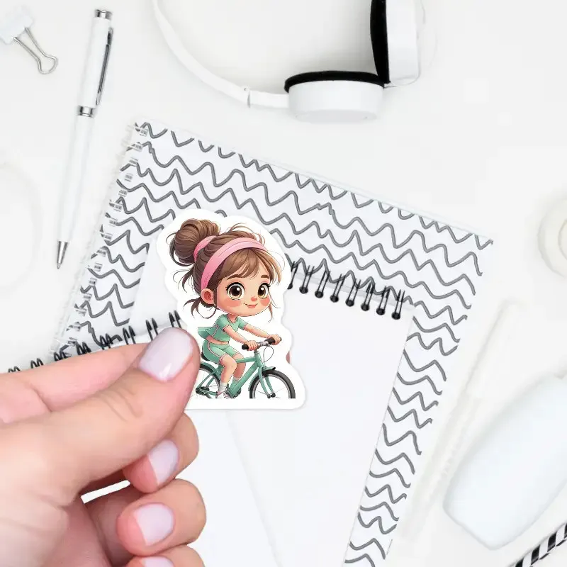 Samolepka holčička na kole.