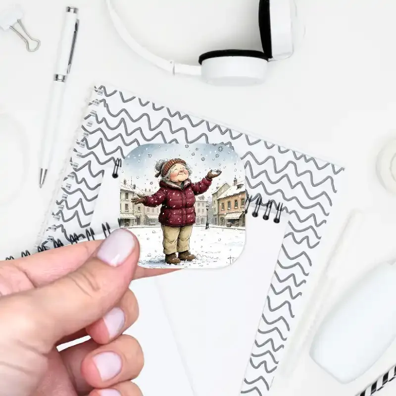 Samolepka do diáře - babička se raduje ze sněhových vloček.