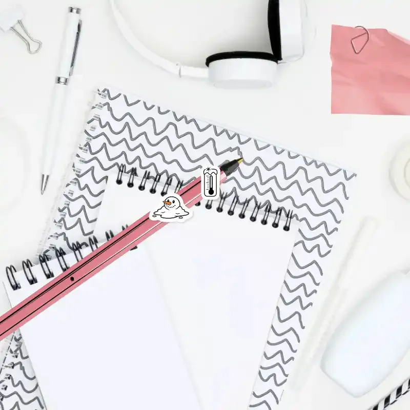 Teploměr jako symbol mrazu a tající sněhulák symbolizující oblevu - diářové nálepky.