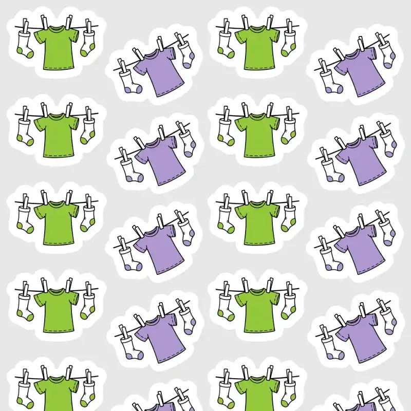 Samolepky pro plánování praní a sušení prádla v diáři v zelené a fialové barvě.