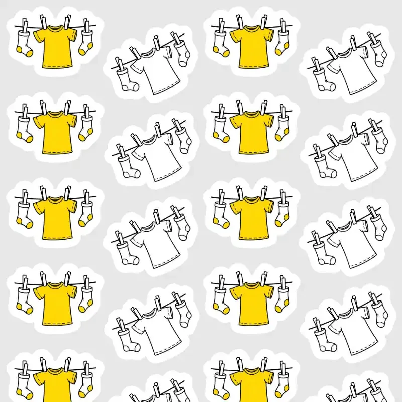 Samolepky pro plánování praní a sušení prádla v diáři ve žluté a černobílé barvě.